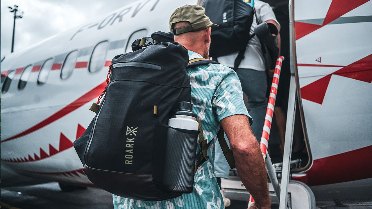 Jeff Johnson walking onto a plane