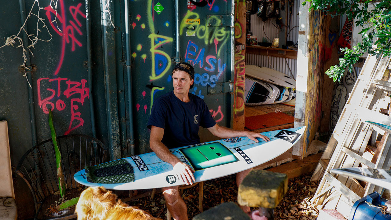 Lucas Godfrey with surfboards
