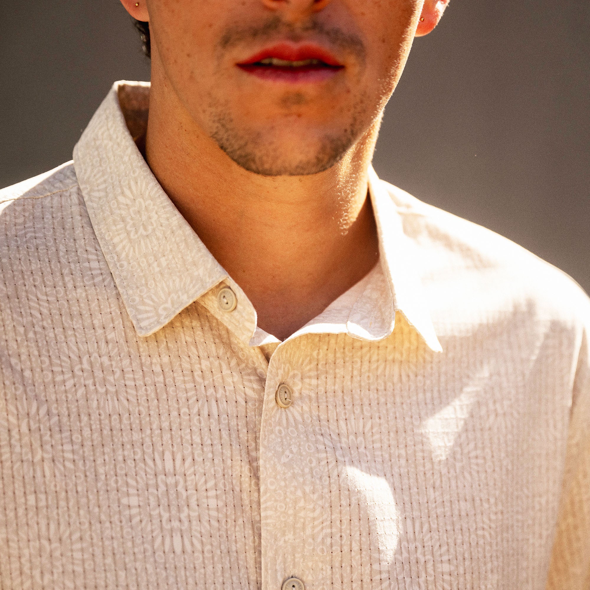 Bless Up Breathable Stretch Shirt in Sand, worn by a model, collar and chest detail