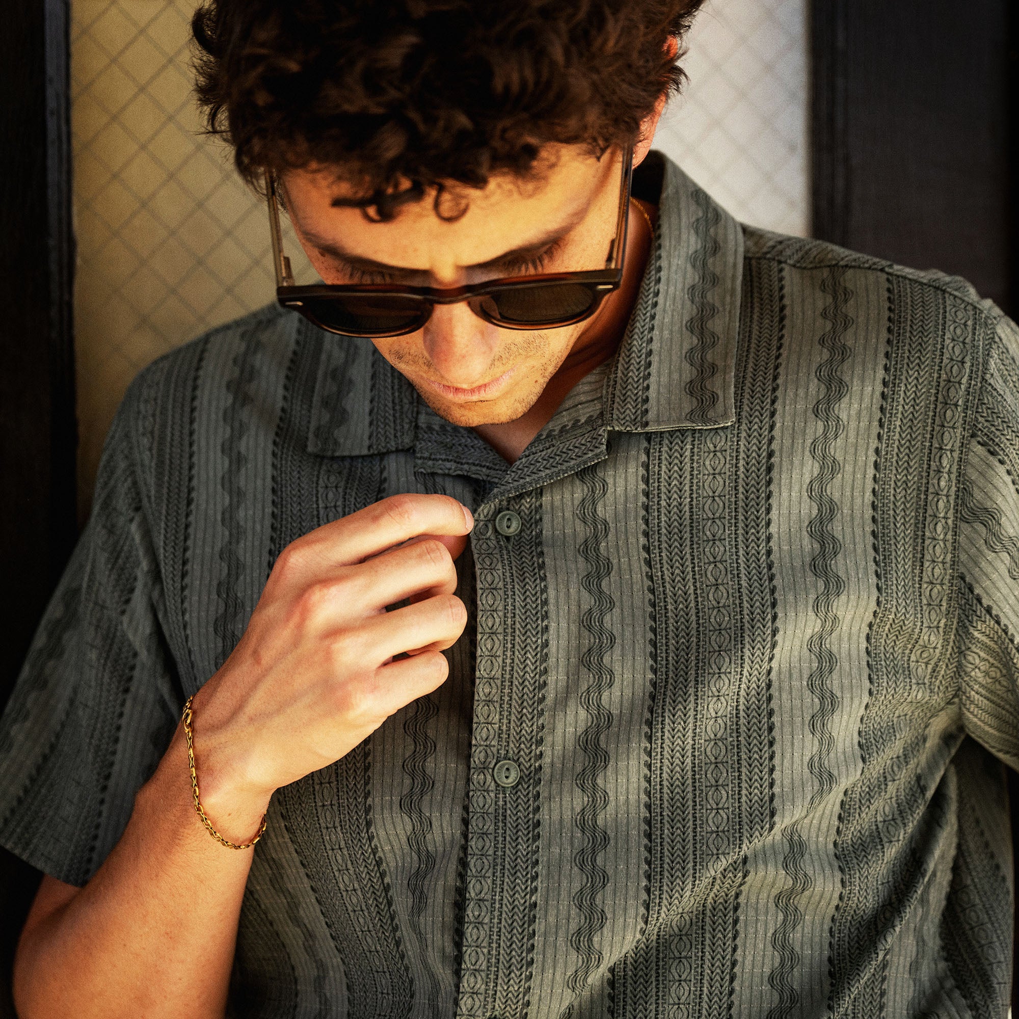 Bless Up Trail Button Up Shirt in Dark Slate, worn by a model, print detail