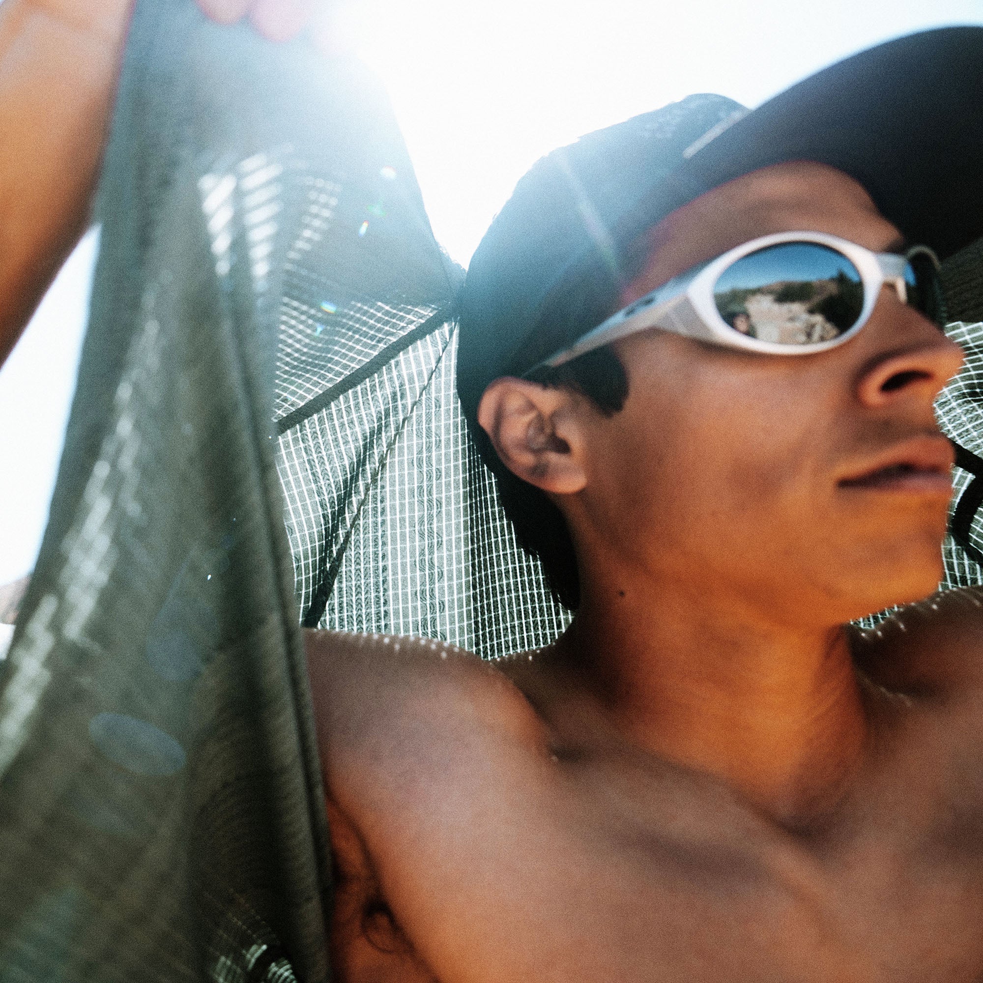 Bless Up Trail Button Up Shirt, worn by a model outdoors in bright sun, cap and sunglasses