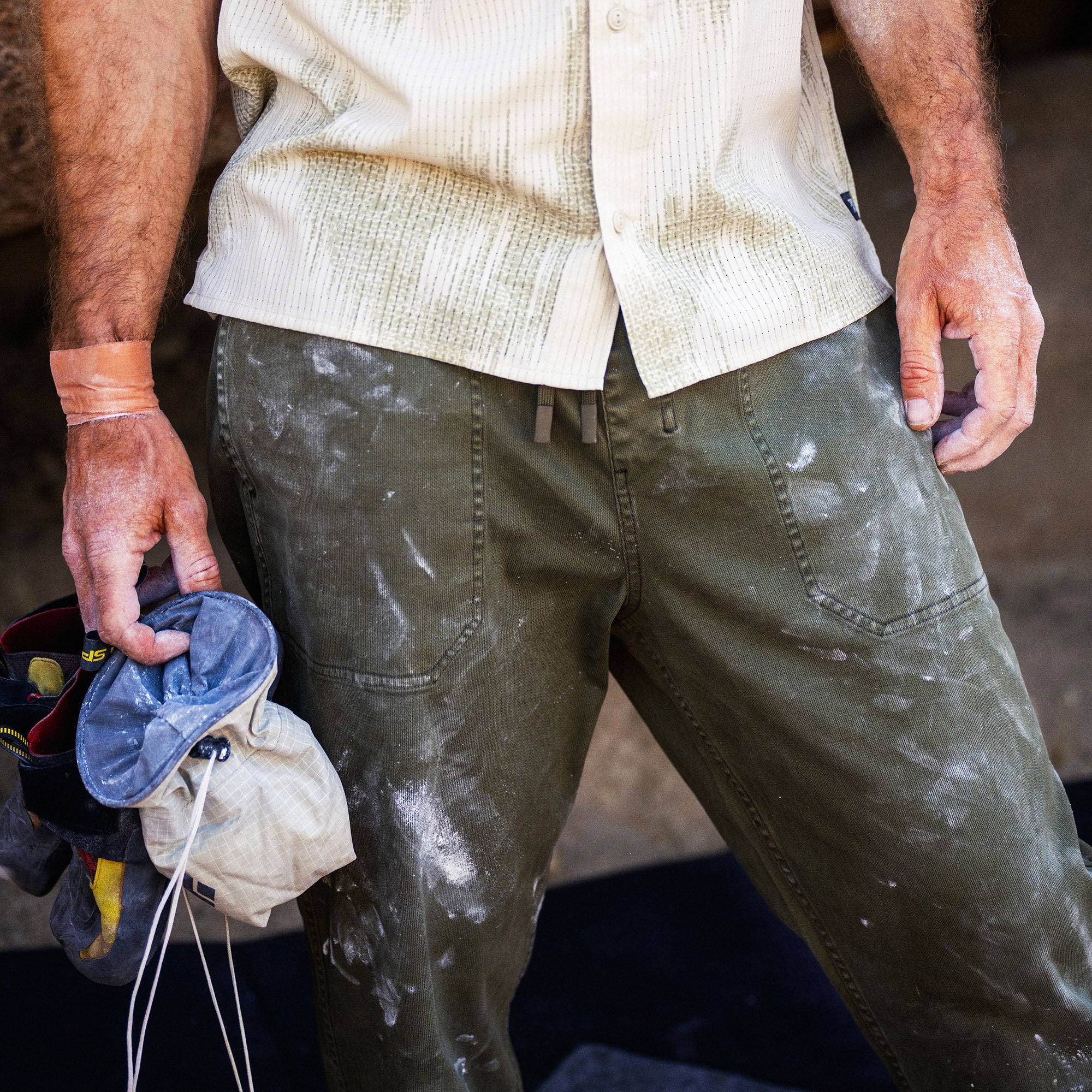 Bless Up Trail Button Up Shirt in Sand, worn by a model holding work gloves, waist detail