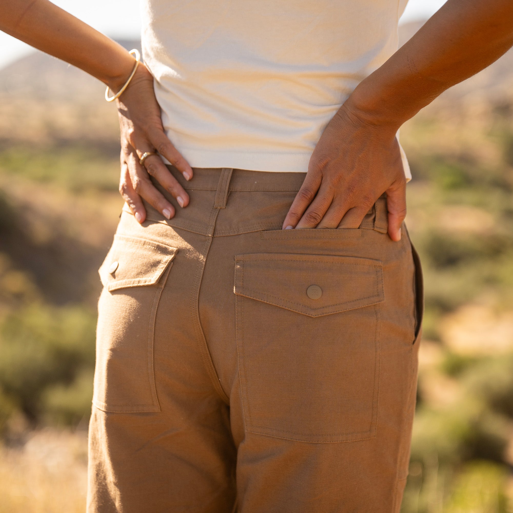 Layover Utility Pants in Dark Khaki, worn by a model, waistband and pocket detail