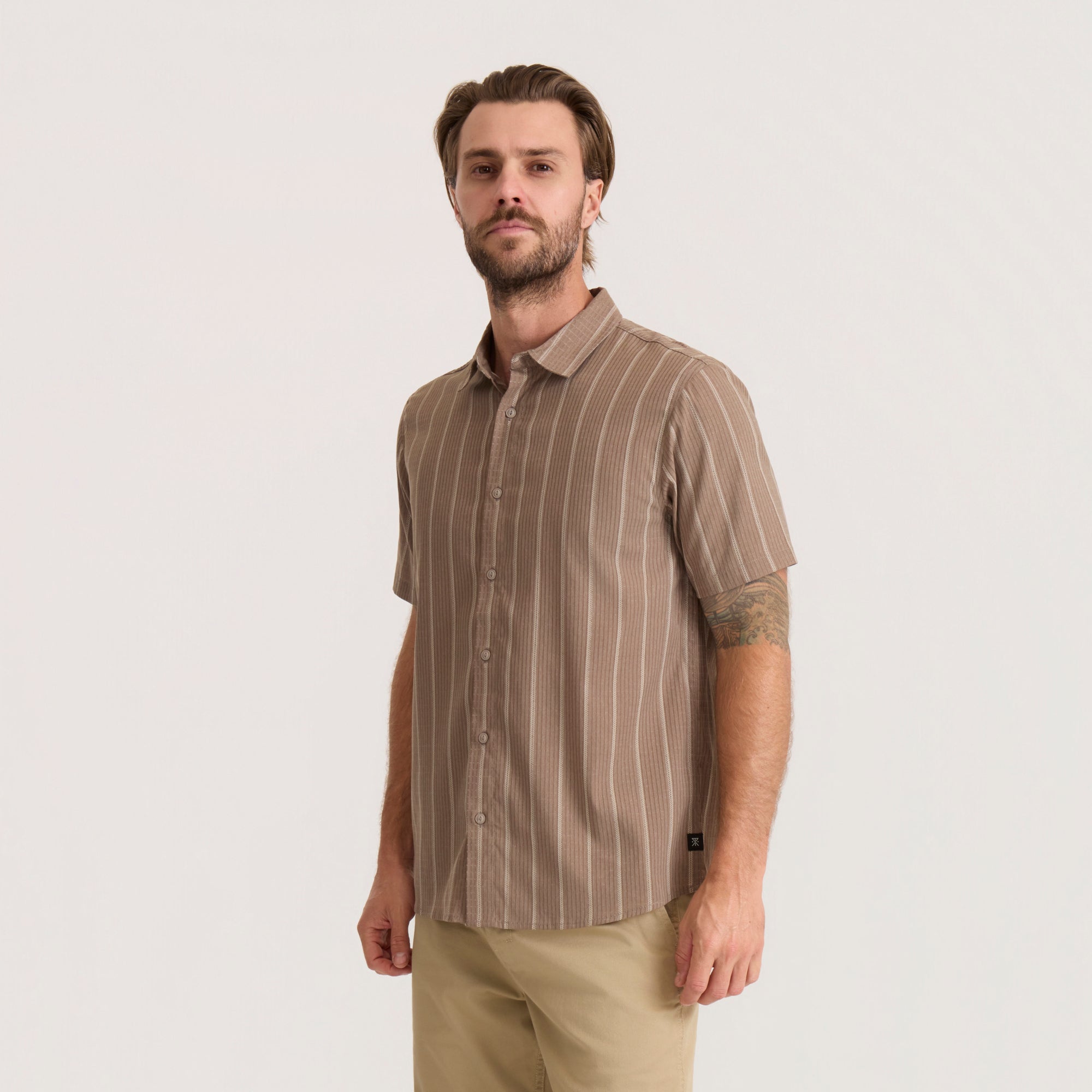 Bless Up Breathable Stretch Shirt in mushroom with vertical pinstripe, short sleeves, worn by model with khaki pants