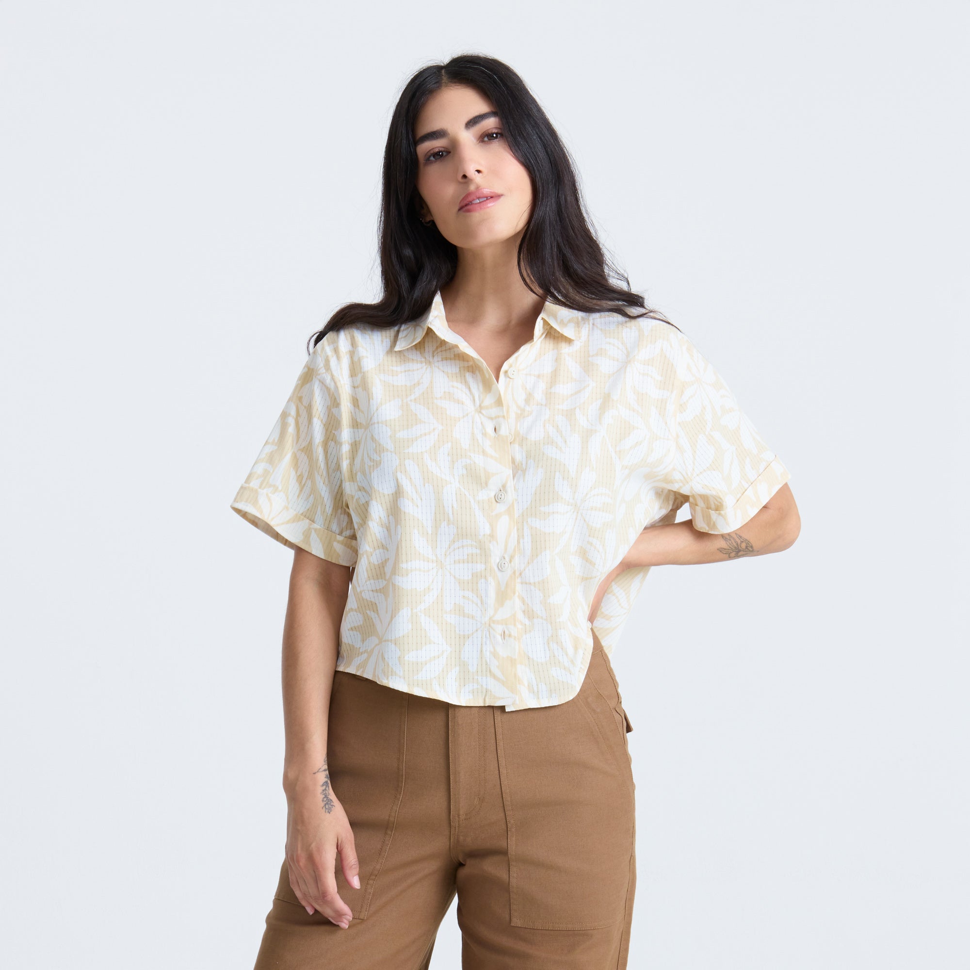 Adventurous traveler overlooking scenic landscape at sunset, capturing the spirit of Roark's exploration ethos.